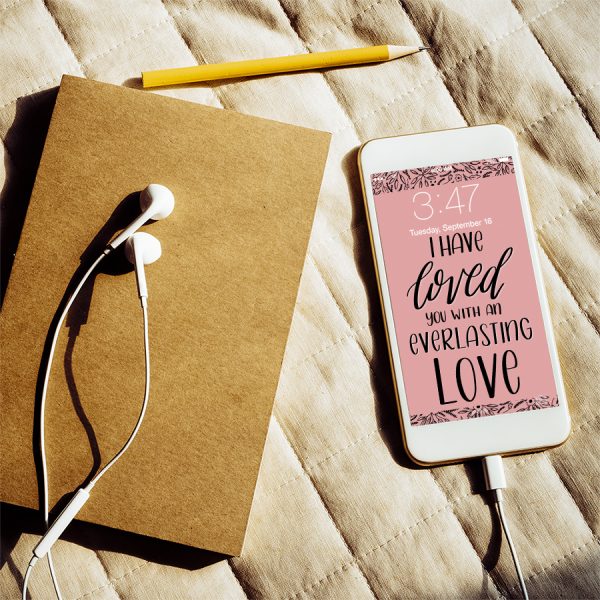 phone with lockscreen and journal on bed pexels Porapak Apichodilok | Lettering for Jesus wallpapers