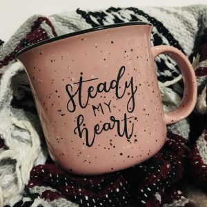 Pink Steady My Heart Campfire Mug on a blanket